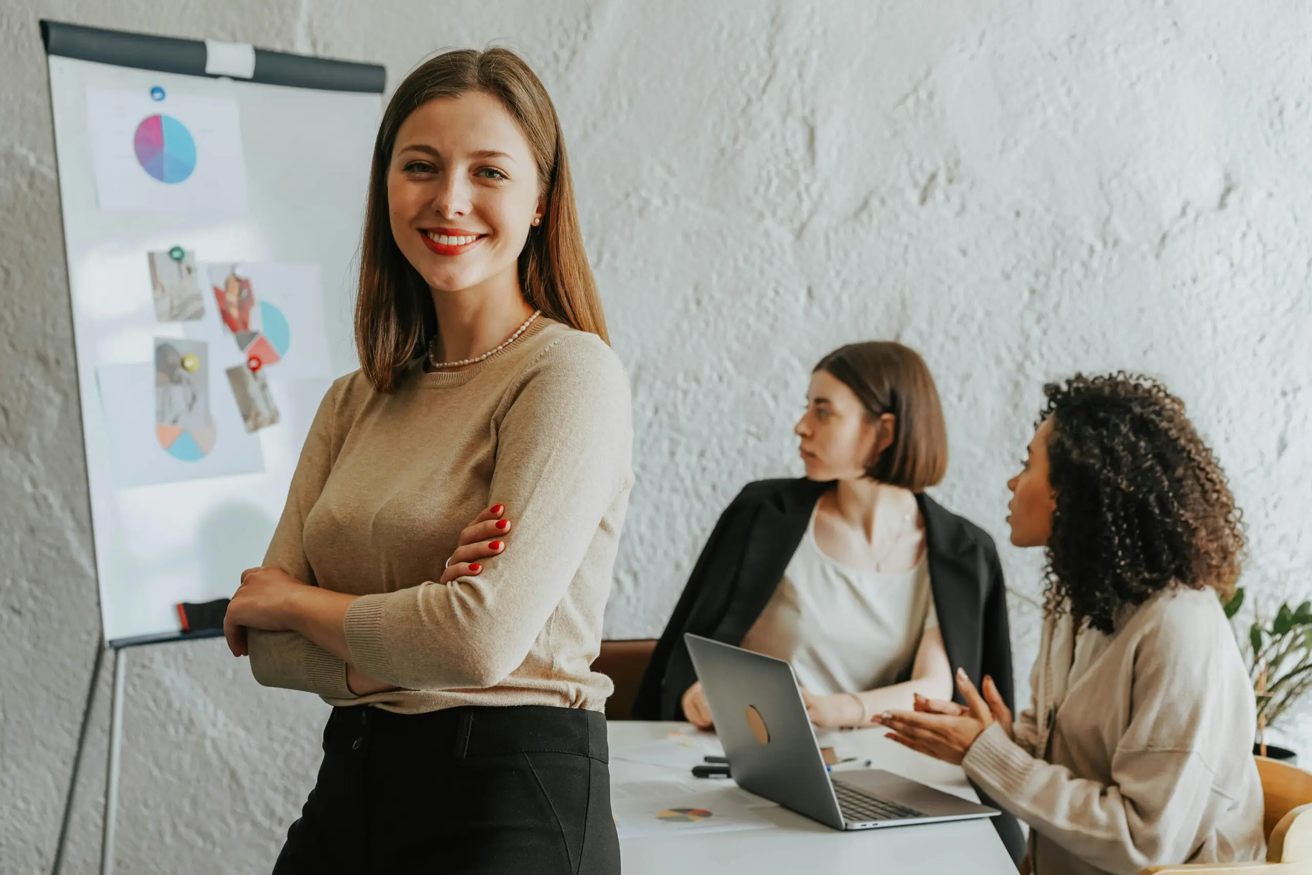 Woman presenting proud to team.