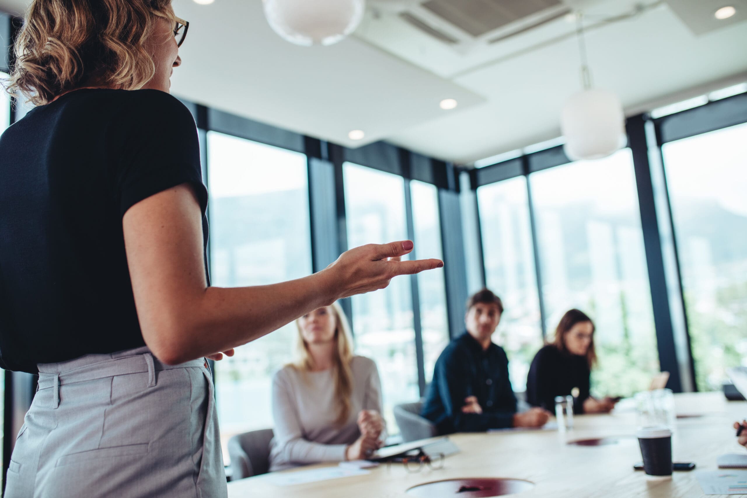 Businesswoman making a presentation to her colleagues in office 